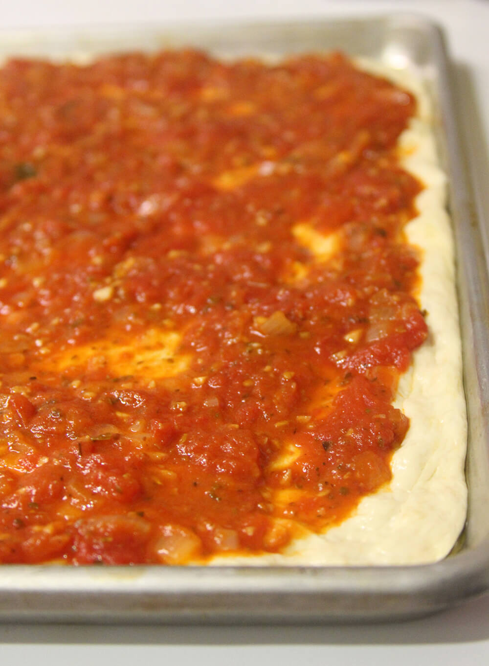 A tomato pie right before it goes into the oven